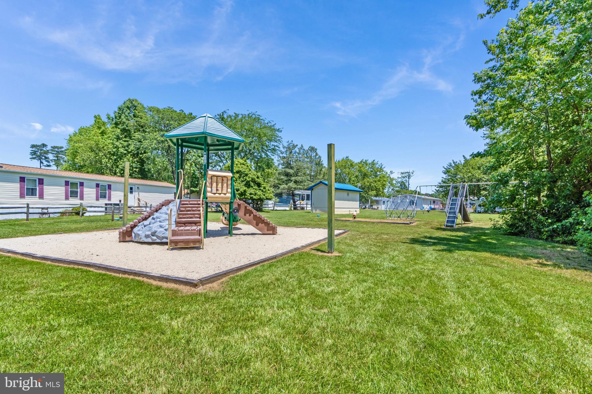21263 K Street, Unit 37217 Rehoboth Beach, DE 19971 - Photo 33 of 49 a view of a park with a slide