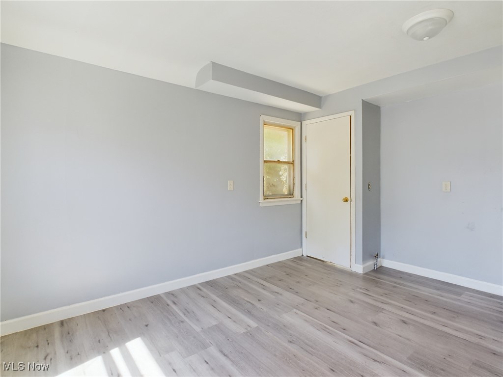 793 Alhambra Road Cleveland, OH 44110 - Photo 9 of 25 Unfurnished room featuring light hardwood / wood-style flooring