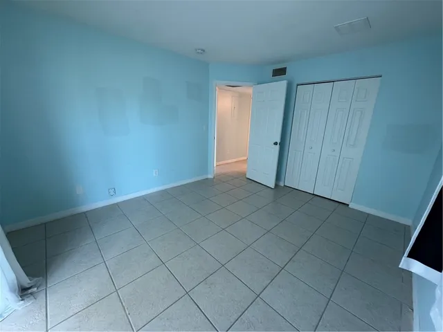 an empty room with a bathroom