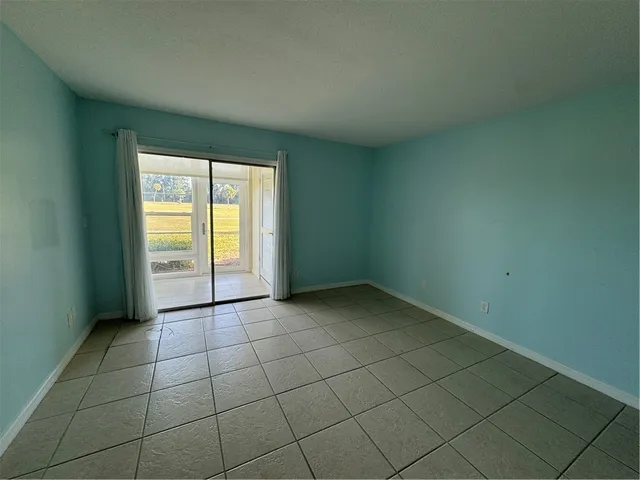 an empty room with a empty space and window