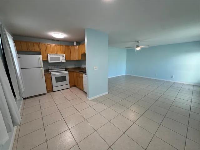 a kitchen with stainless steel appliances a refrigerator and a sink