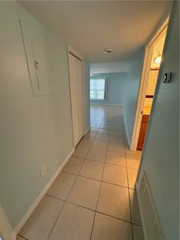 a view of a livingroom with an empty space and window