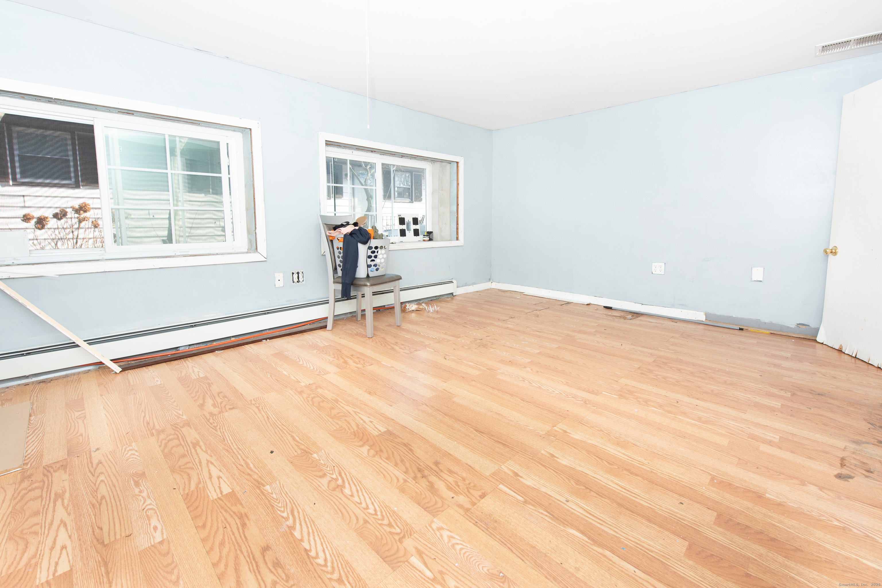 70 Pleasantview Avenue Bridgeport, CT 06606 - Photo 18 of 29 a big room with wooden floor and windows
