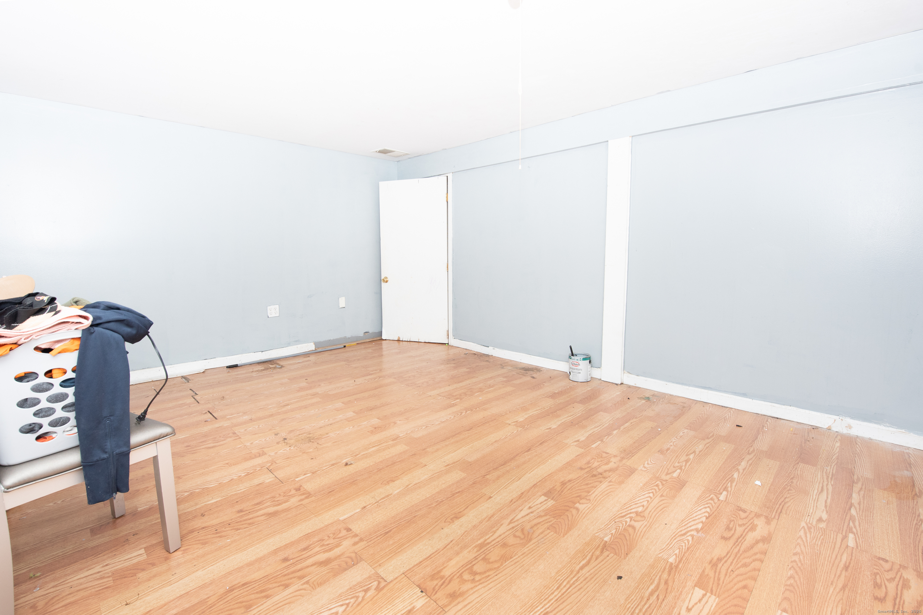 70 Pleasantview Avenue Bridgeport, CT 06606 - Photo 19 of 29 a view of empty room with wooden floor