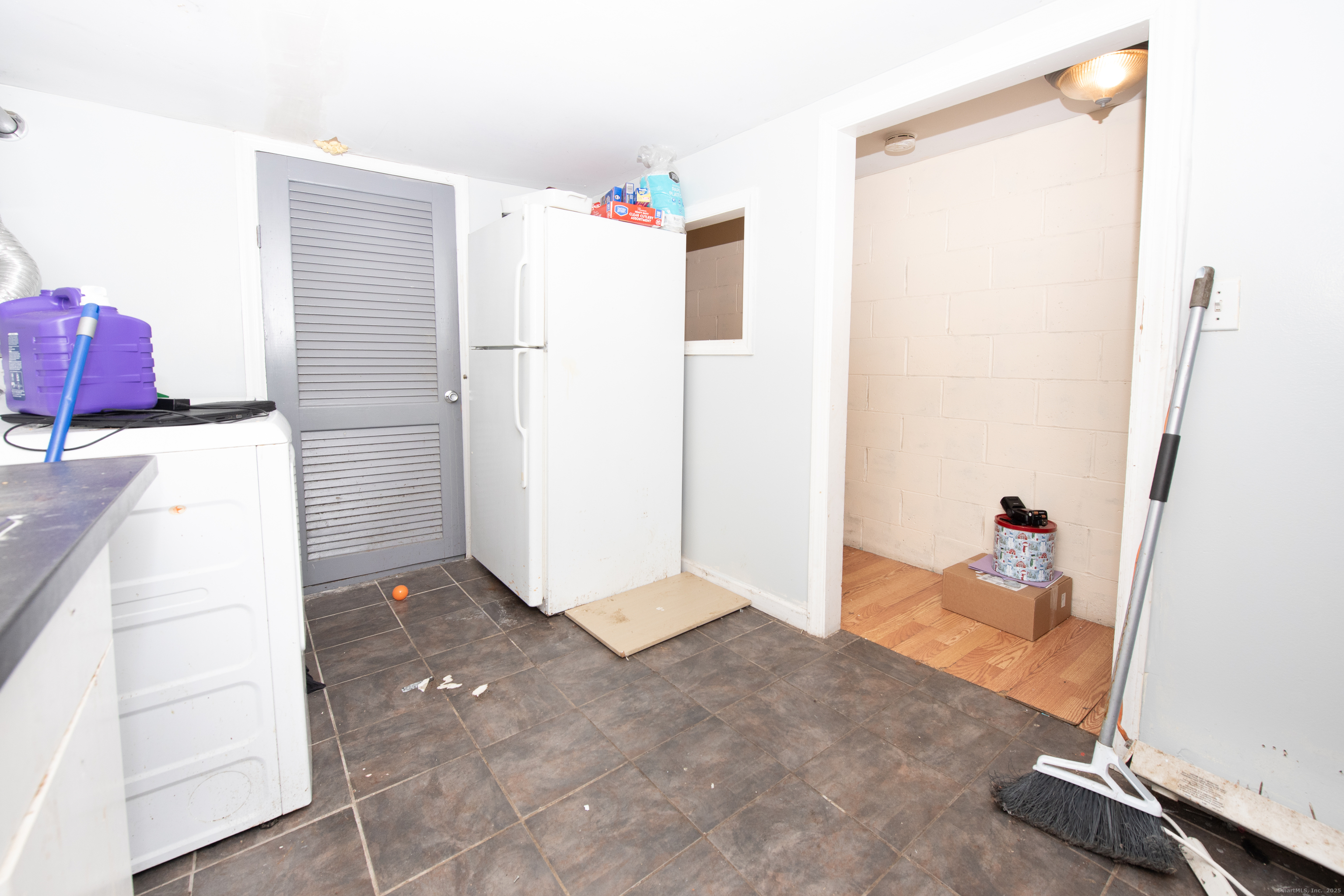 70 Pleasantview Avenue Bridgeport, CT 06606 - Photo 22 of 29 a kitchen with a refrigerator and microwave