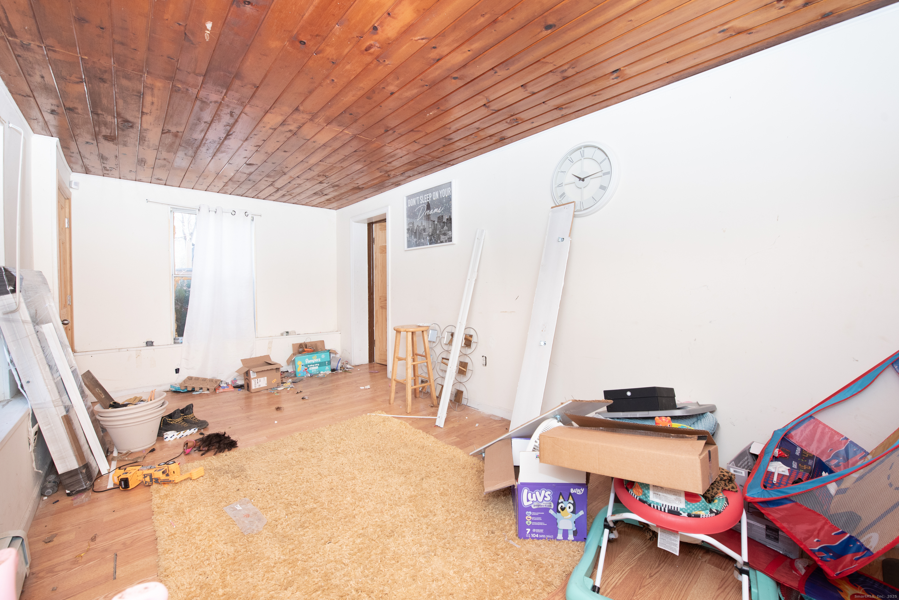 70 Pleasantview Avenue Bridgeport, CT 06606 - Photo 26 of 29 a room with furniture and a large window