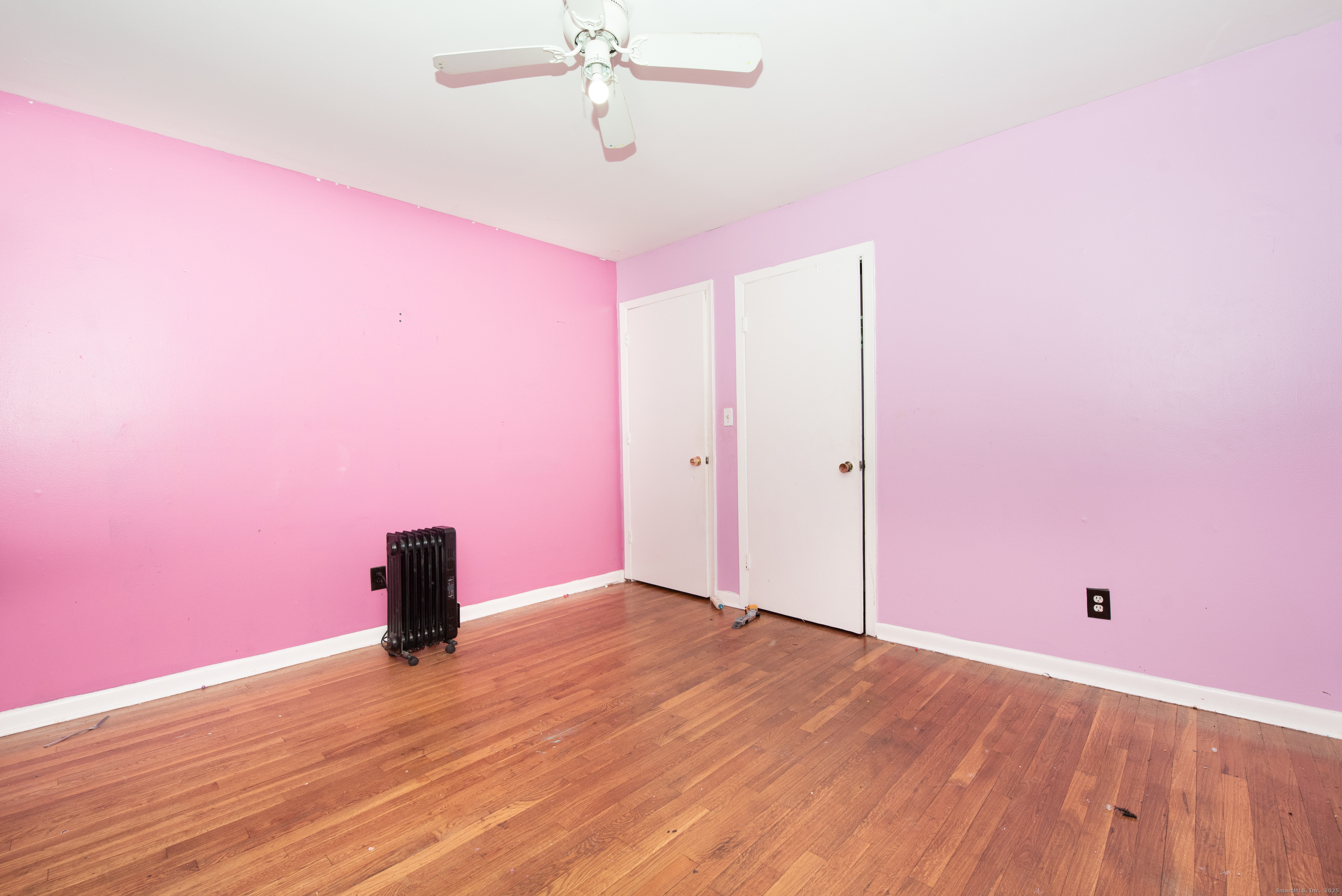 70 Pleasantview Avenue Bridgeport, CT 06606 - Photo 10 of 29 a view of empty room with wooden floor
