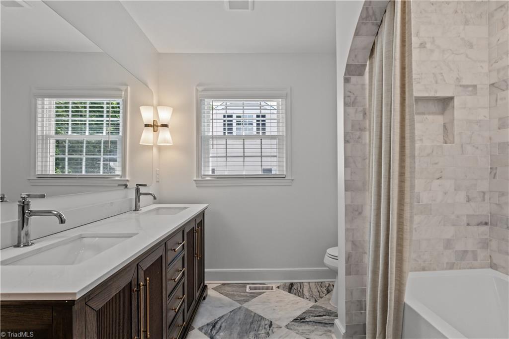 118 East Keeling Road Greensboro, NC 27410 - Photo 25 of 32 Third full bath gives 6 total bathroom sinks. Remarkable design.