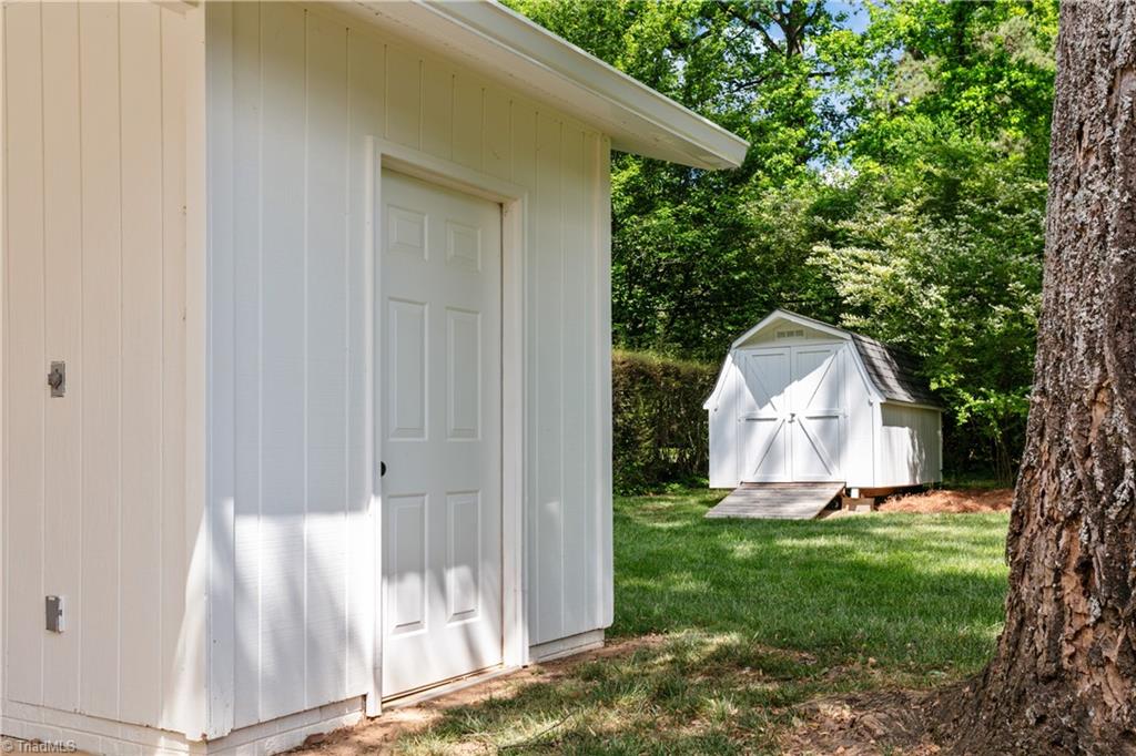 118 East Keeling Road Greensboro, NC 27410 - Photo 30 of 32 Additional carport storage AND storage building.