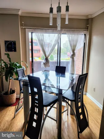 a living room with furniture rug and wooden floor
