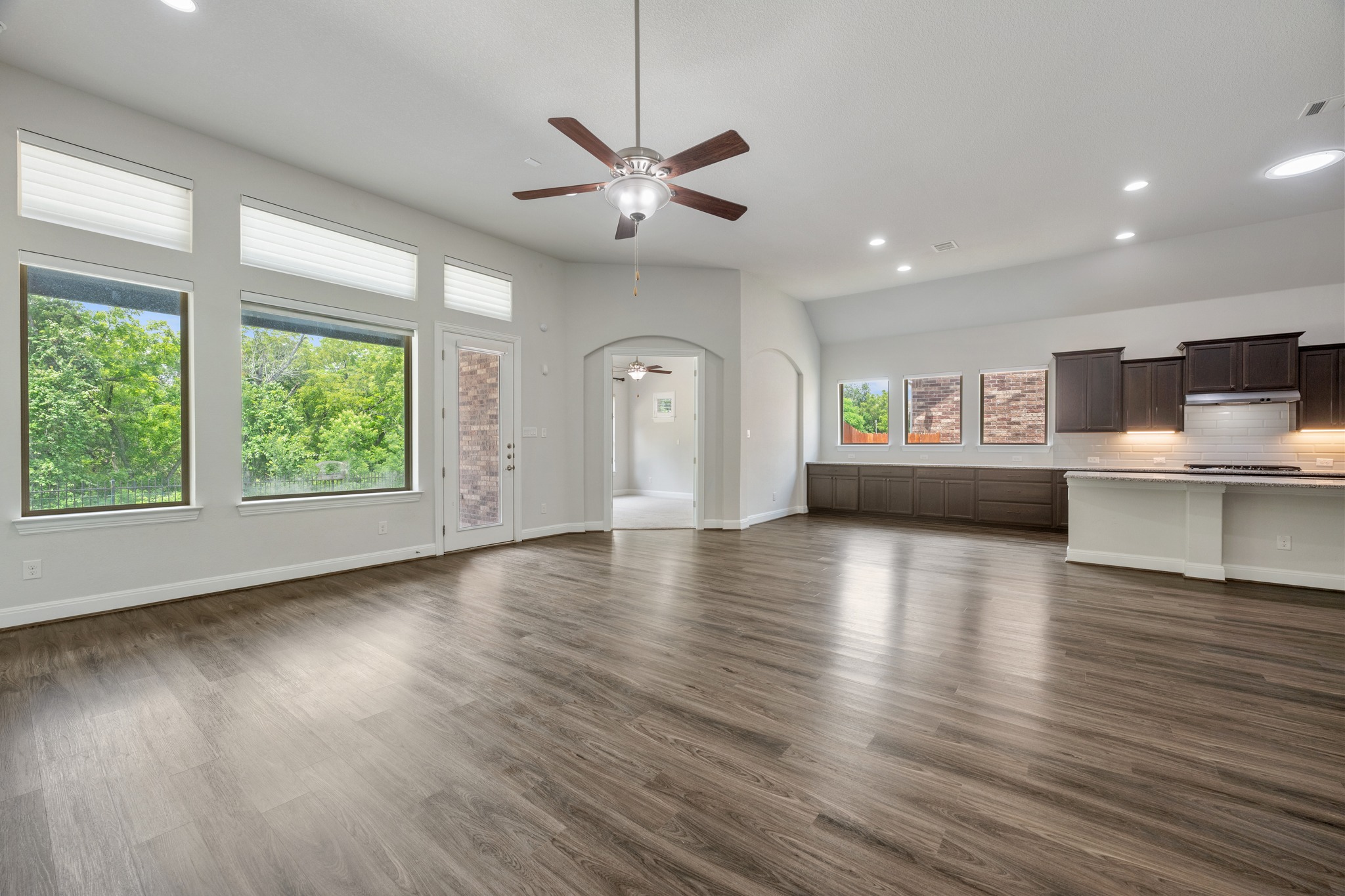 2709 Steece Way Leander, TX 78641 - Photo 15 of 39 a view of an empty room with wooden floor and a window