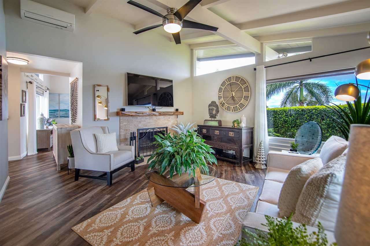 78 Ka Drive, Unit 1 Kula, HI 96790 - Photo 11 of 28 a living room with furniture a flat screen tv and a large window