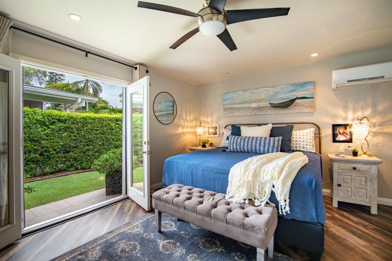 78 Ka Drive, Unit 1 Kula, HI 96790 - Photo 15 of 28 a bedroom with furniture and a large window