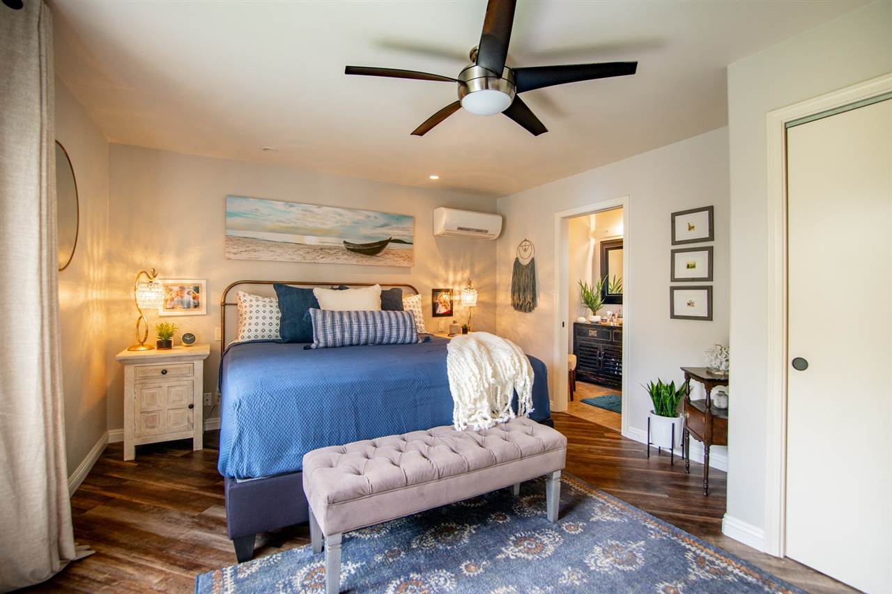 78 Ka Drive, Unit 1 Kula, HI 96790 - Photo 16 of 28 a living room with furniture and a wooden floor