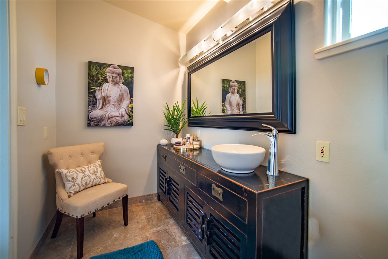 78 Ka Drive, Unit 1 Kula, HI 96790 - Photo 18 of 28 a living room with furniture and a painting on the wall