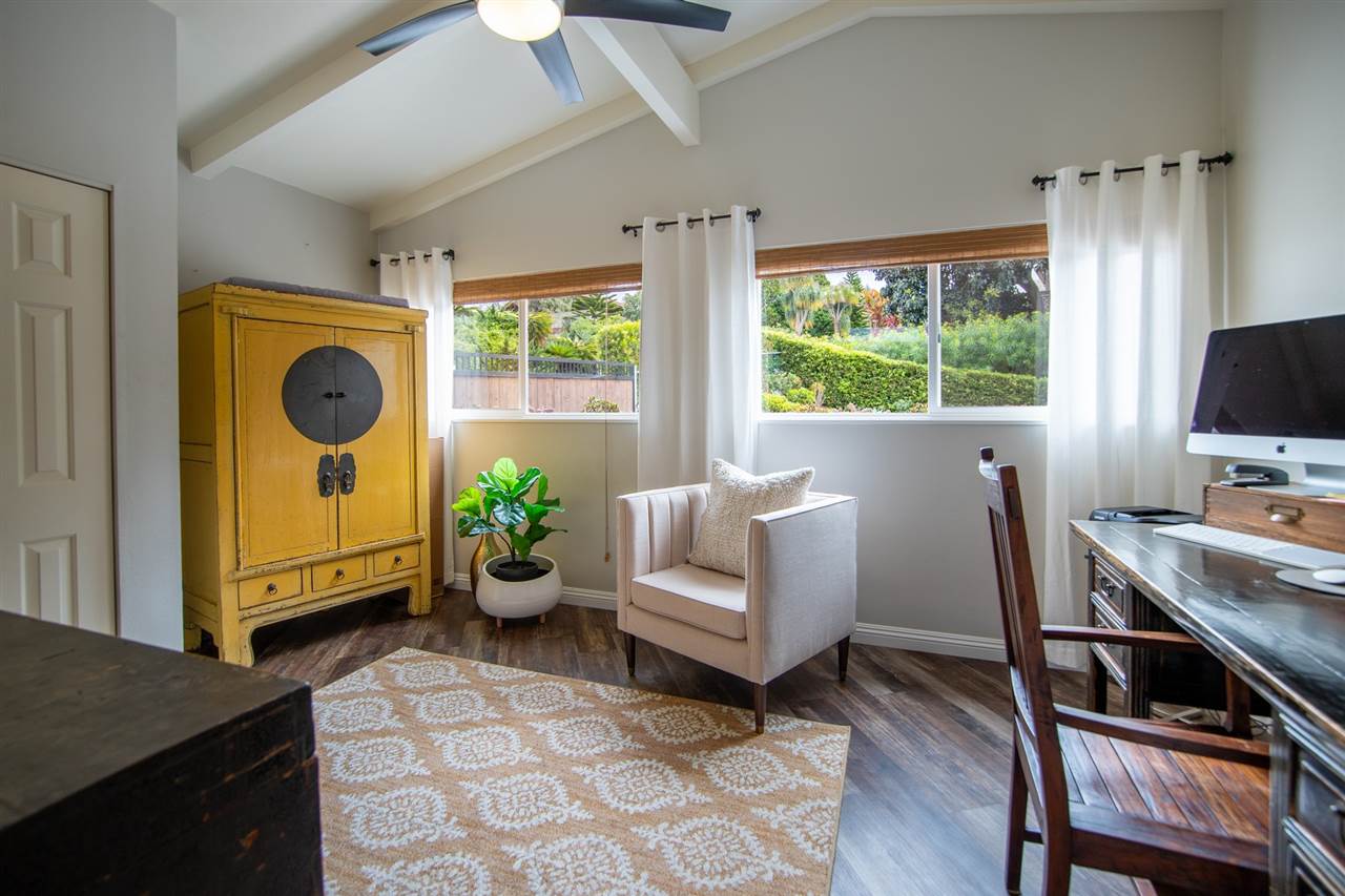 78 Ka Drive, Unit 1 Kula, HI 96790 - Photo 19 of 28 a living room with furniture a window and a flat screen tv
