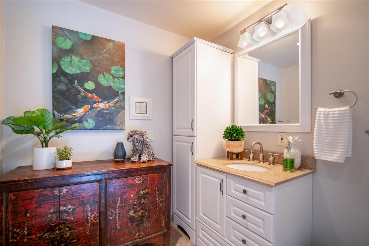 78 Ka Drive, Unit 1 Kula, HI 96790 - Photo 21 of 28 a bathroom with a sink a vanity and a mirror
