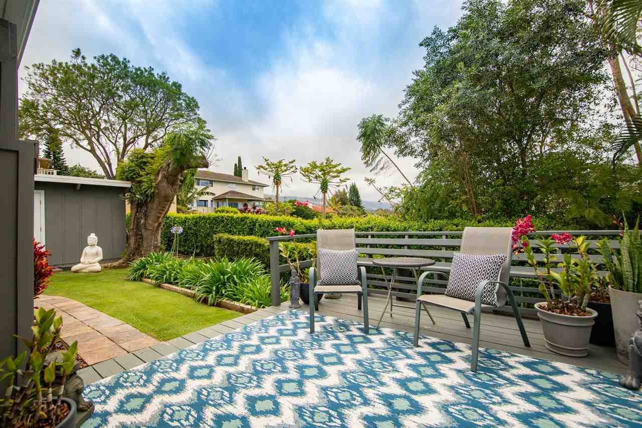 78 Ka Drive, Unit 1 Kula, HI 96790 - Photo 23 of 28 a view of a chairs and table in backyard of the house