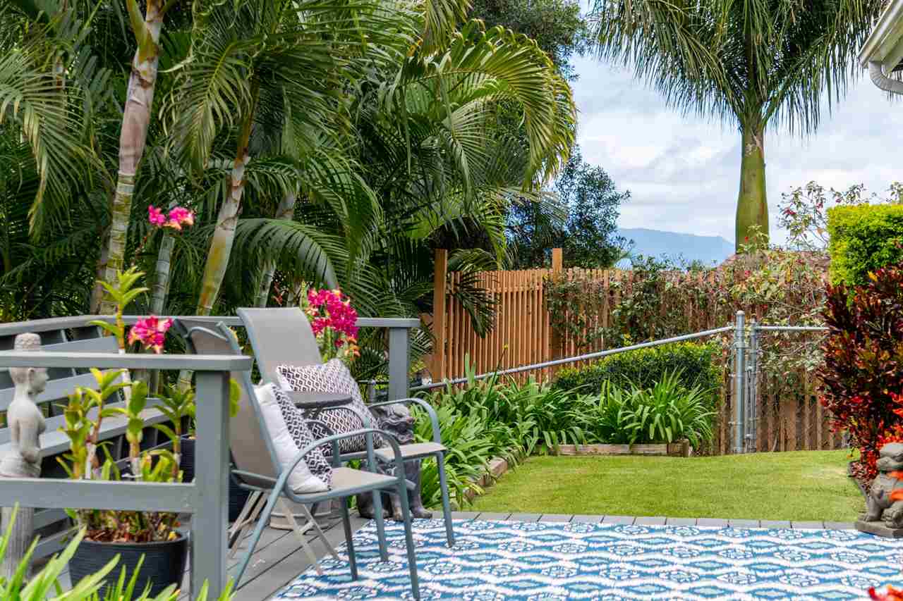 78 Ka Drive, Unit 1 Kula, HI 96790 - Photo 24 of 28 a backyard of a house with seating space and trees