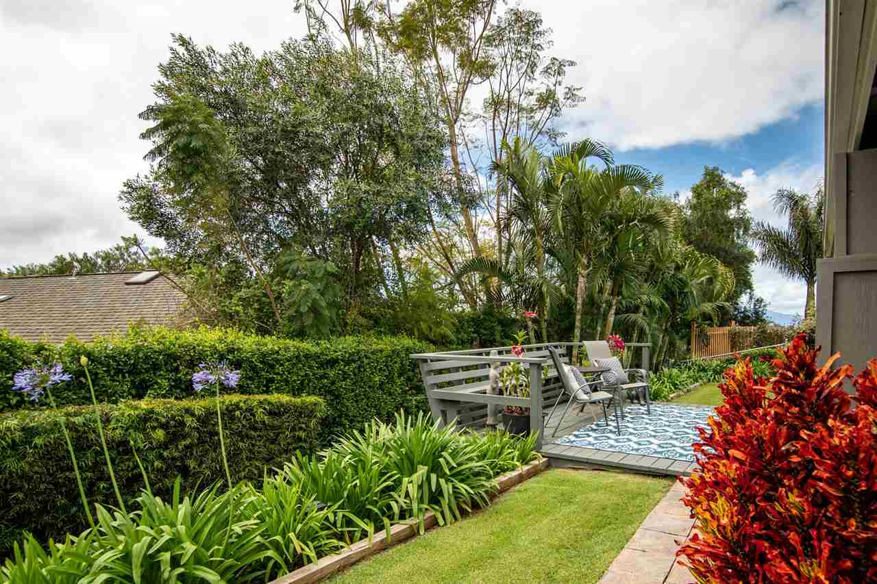 78 Ka Drive, Unit 1 Kula, HI 96790 - Photo 25 of 28 a view of a chair and tables in the garden