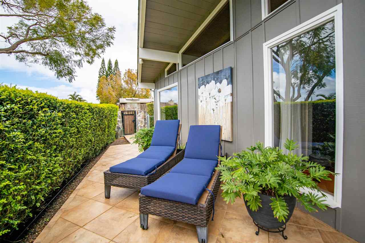 78 Ka Drive, Unit 1 Kula, HI 96790 - Photo 28 of 28 a view of a chairs in a patio with potted plants