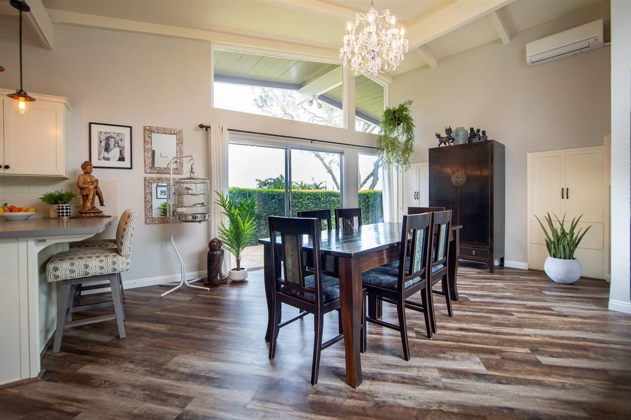 78 Ka Drive, Unit 1 Kula, HI 96790 - Photo 8 of 28 a view of a dining room with furniture window and wooden floor