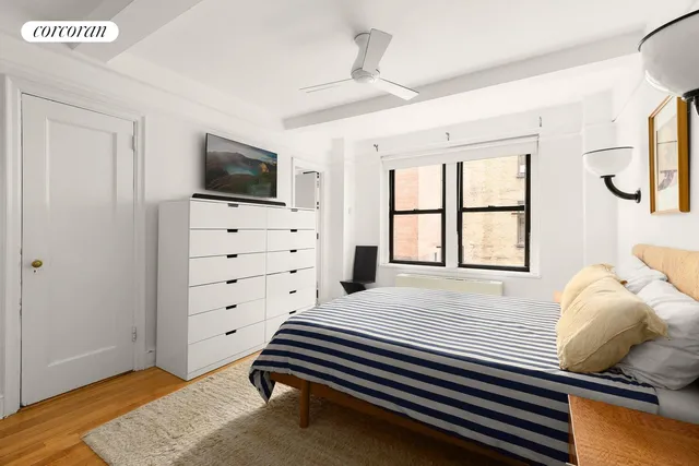 a bedroom with a bed and furniture