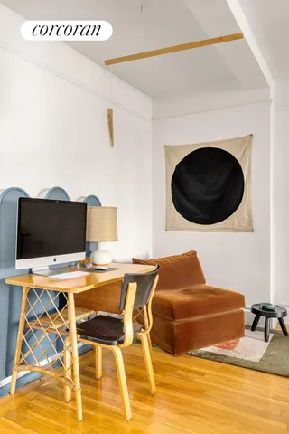 a room with a table and a lamp