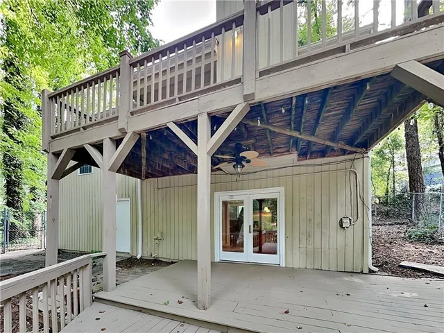 a view of a house with wooden deck