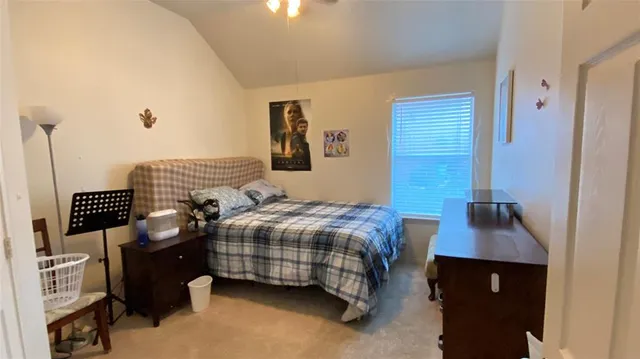 a bedroom with a bed and a table