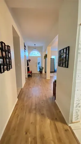 a view of a livingroom with furniture and a window