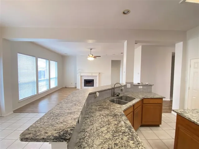 a living room with couches and furniture with rug