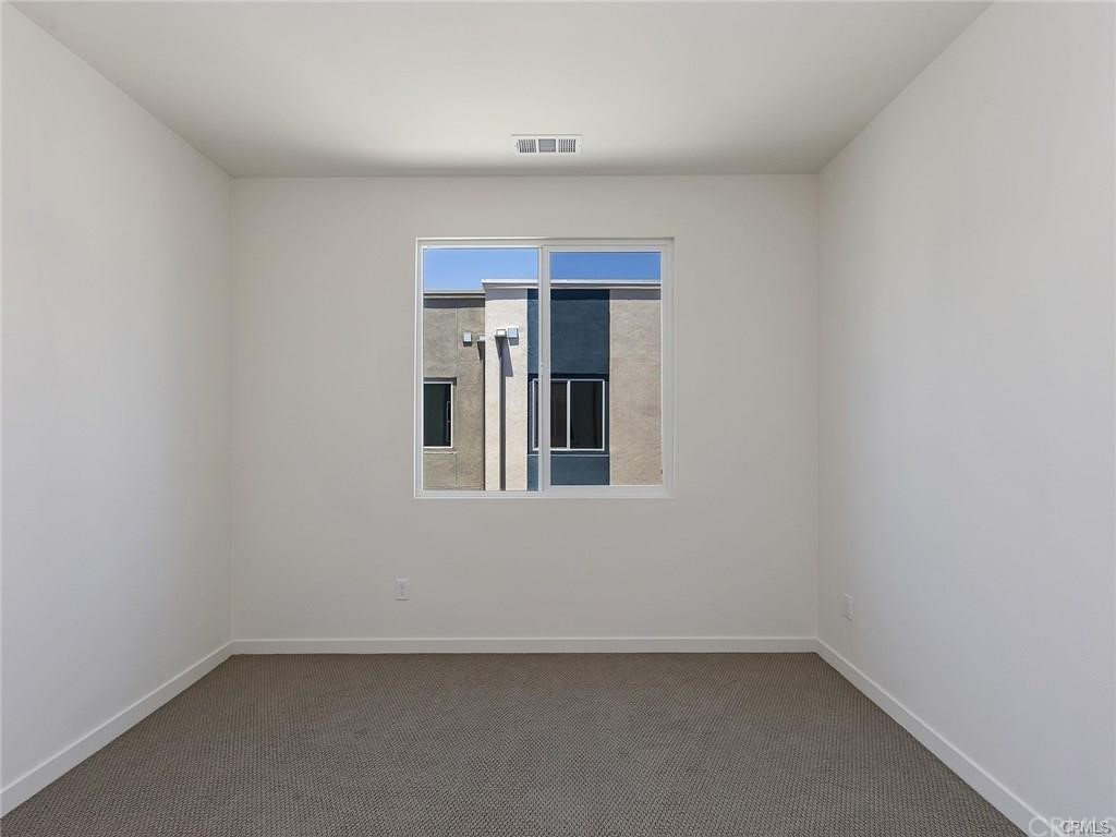 106 Citysquare Irvine, CA 92614 - Photo 12 of 21 an empty room with a window