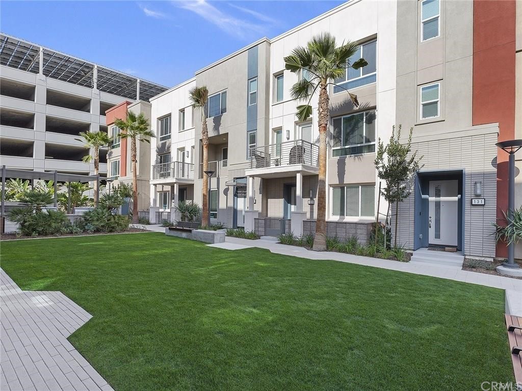 106 Citysquare Irvine, CA 92614 - Photo 19 of 21 a view of a building with a yard