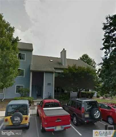 a car parked in front of a house