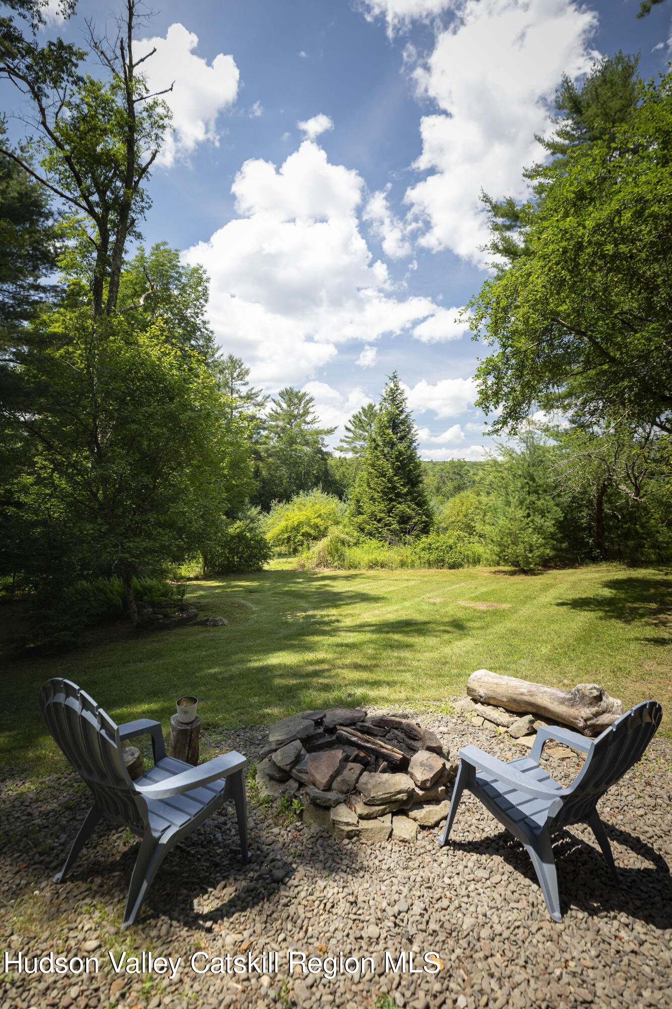 5646 Red Hill Road Claryville, NY 12725 - Photo 30 of 30 a bench sitting in middle of a lake with lawn chairs