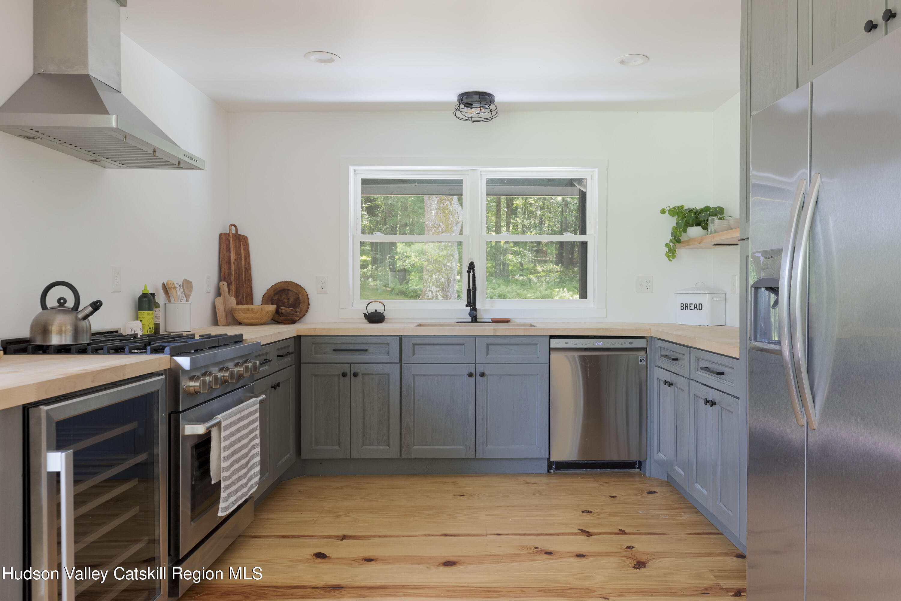 5646 Red Hill Road Claryville, NY 12725 - Photo 5 of 30 a kitchen with stainless steel appliances granite countertop a sink stove and refrigerator