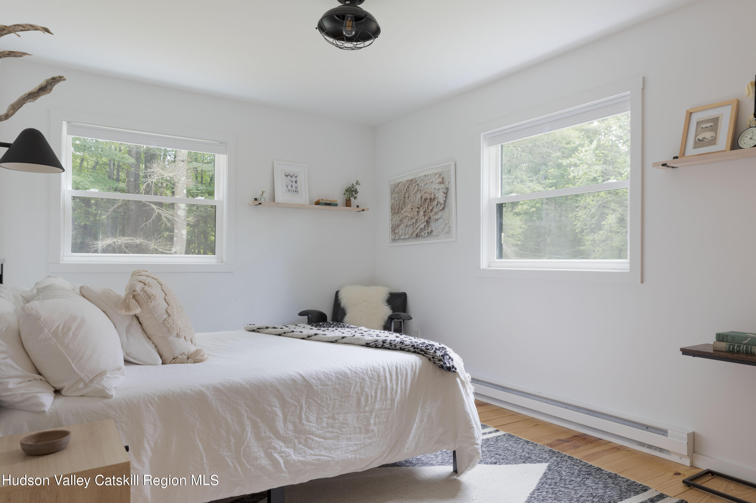 5646 Red Hill Road Claryville, NY 12725 - Photo 9 of 30 a bedroom with a bed and a window