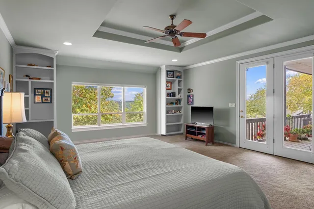 a bed room with a bed and a television