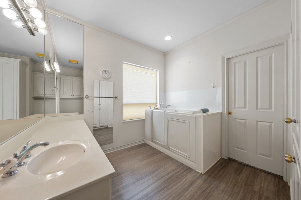 101 Crestline Kerrville, TX 78028 - Photo 17 of 47 a bathroom with a sink a mirror and shower