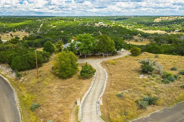 a view of a swimming pool with a yard