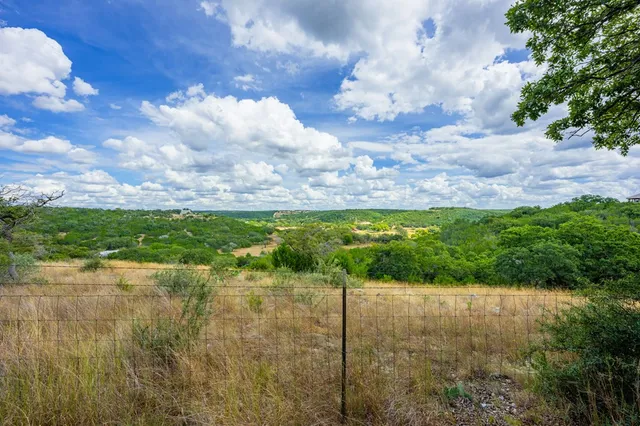 a view of a lake with a yard