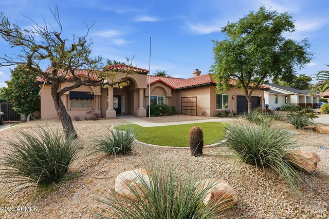 a front view of a house with garden