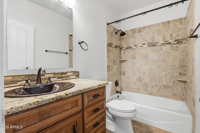 a bathroom with a sink a toilet and a bathtub