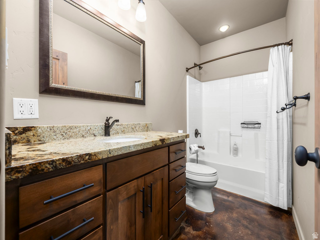 22677 East Snowbird Drive, Unit 47 Helper, UT 84526 - Photo 31 of 43 Bathroom featuring vanity, concrete flooring, and shower / tub combo with curtain