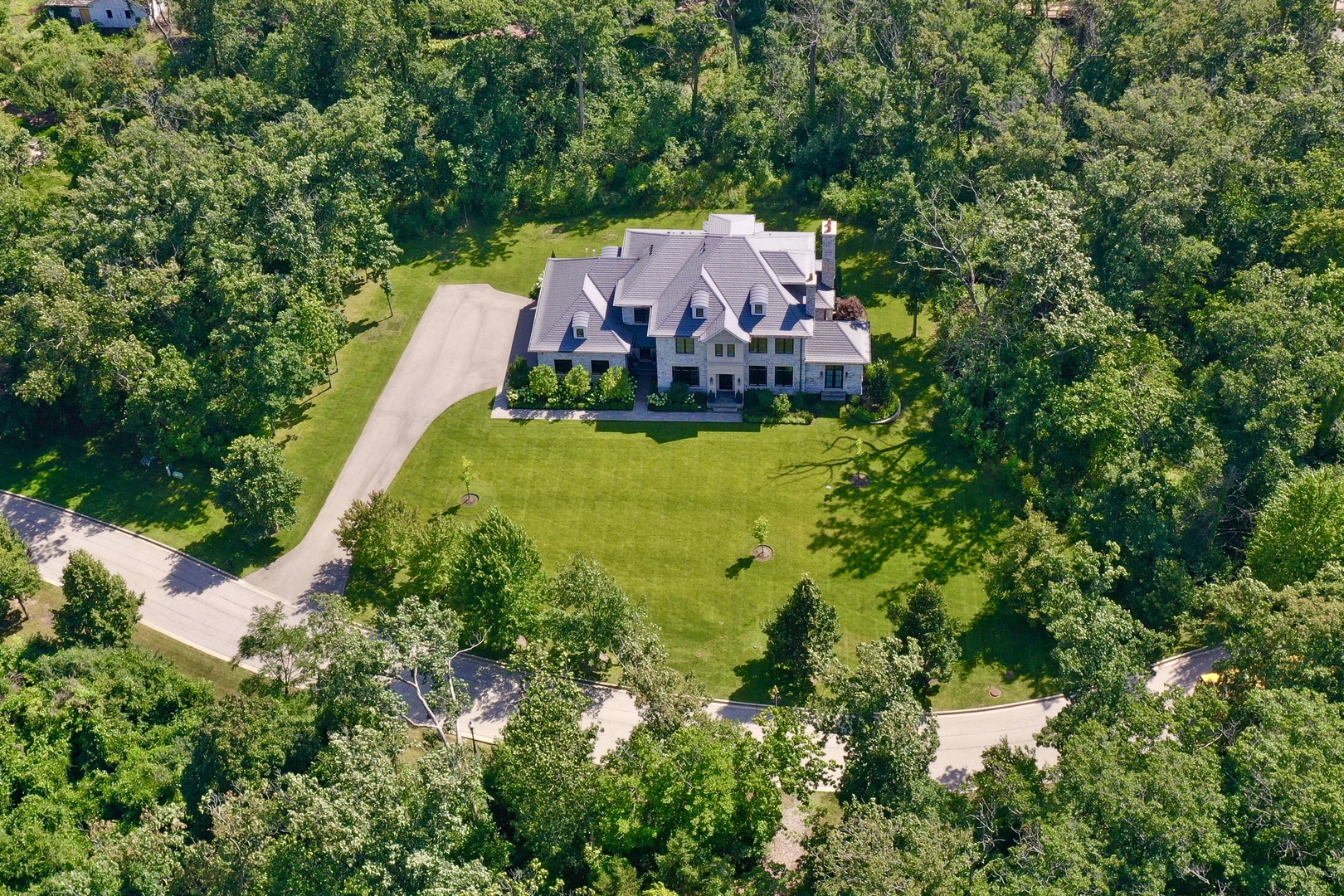 an aerial view of a house with a garden
