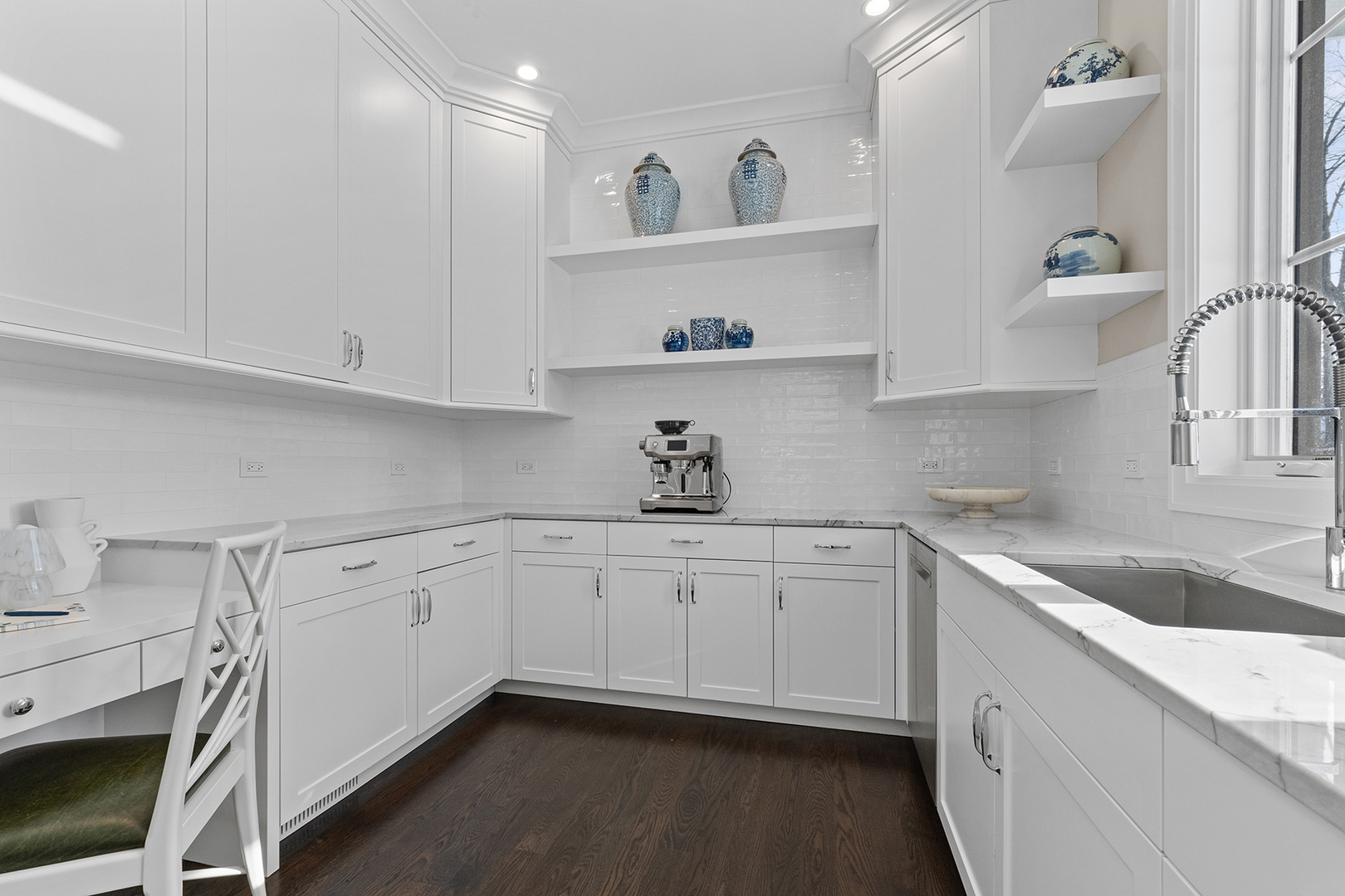 511 Lansdowne Lane Lake Bluff, IL 60044 - Photo 26 of 69 a kitchen with granite countertop white cabinets and white appliances