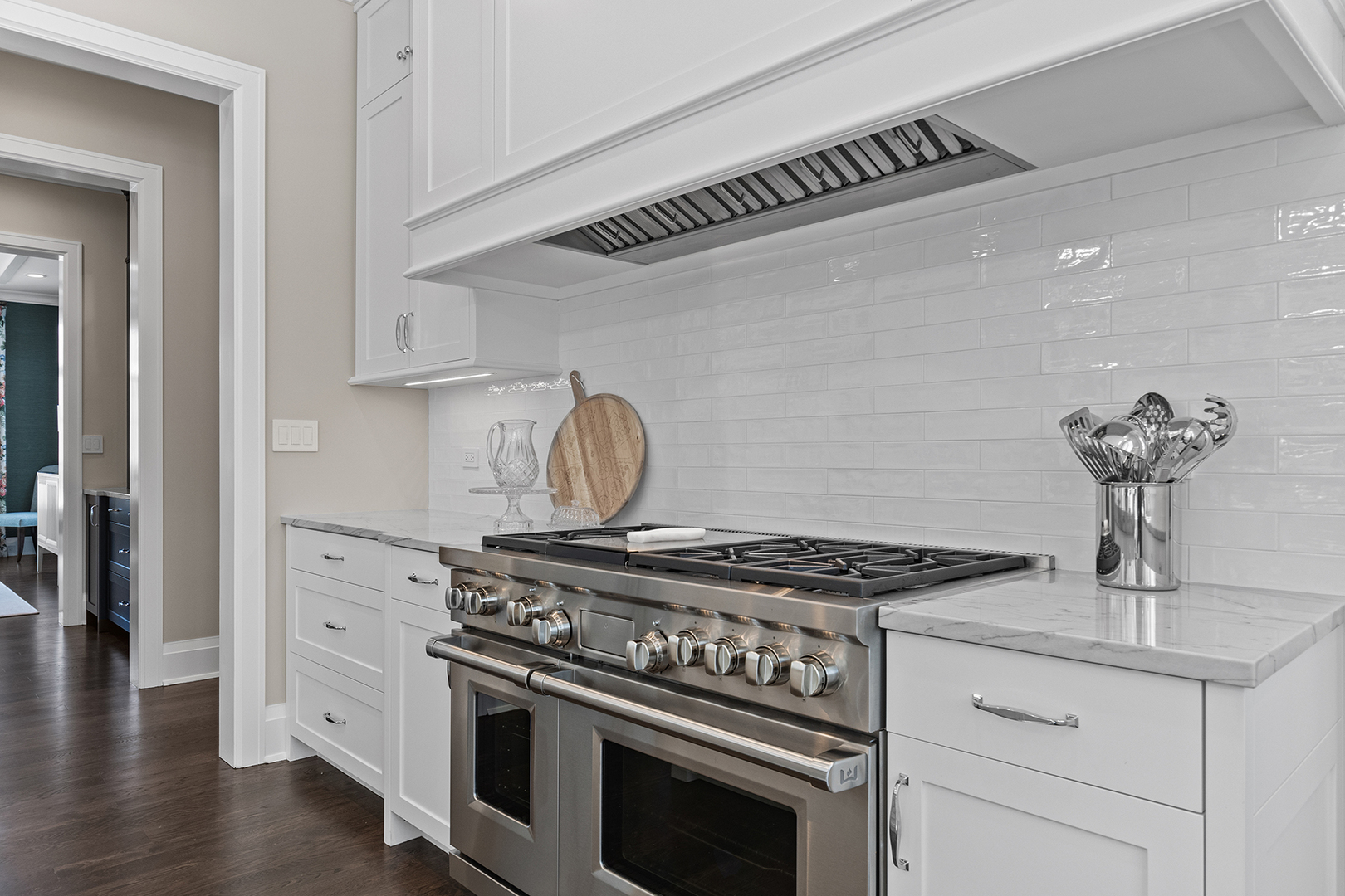 511 Lansdowne Lane Lake Bluff, IL 60044 - Photo 27 of 69 a kitchen with a stove and white cabinets