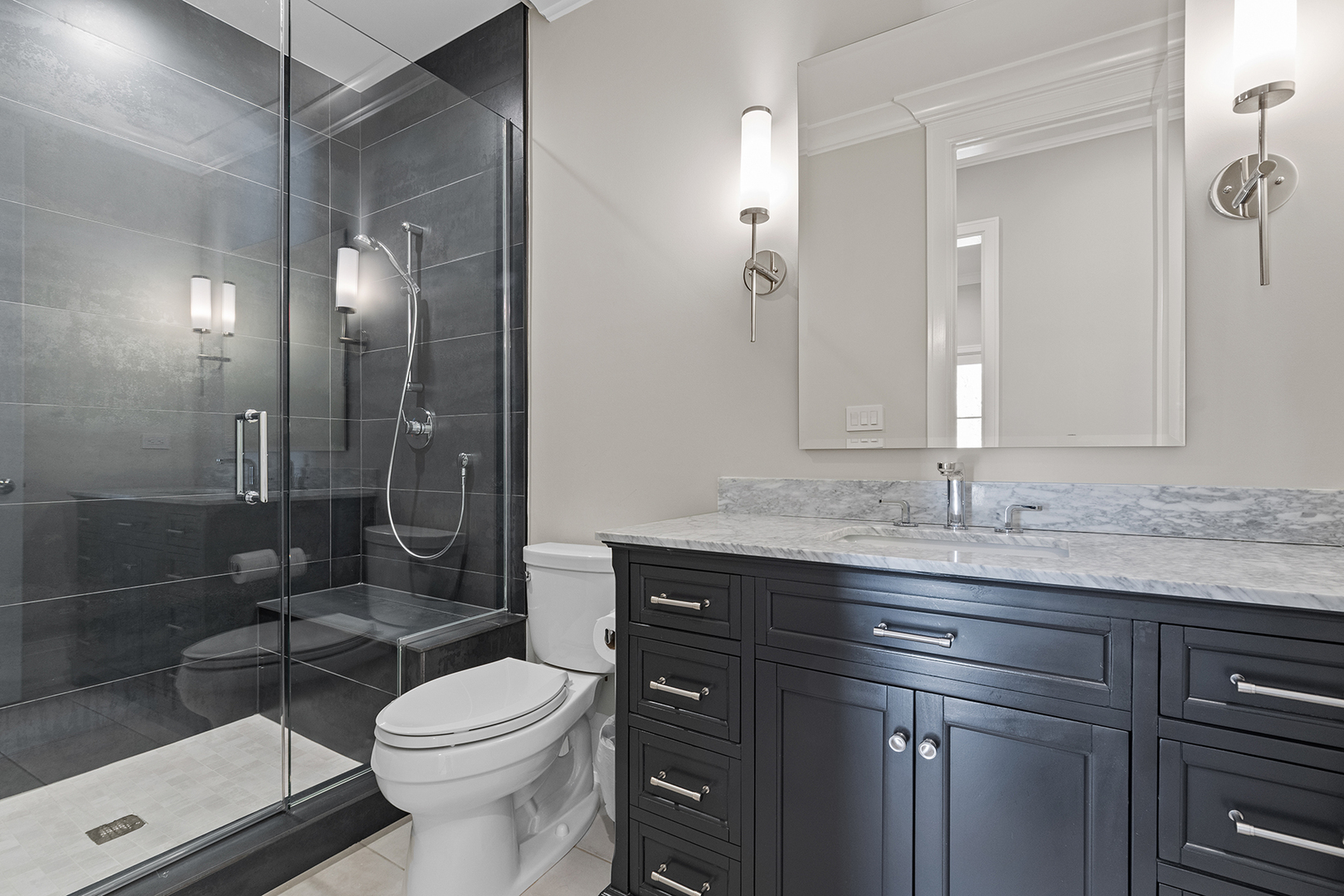511 Lansdowne Lane Lake Bluff, IL 60044 - Photo 29 of 69 a bathroom with a granite countertop sink toilet mirror and shower