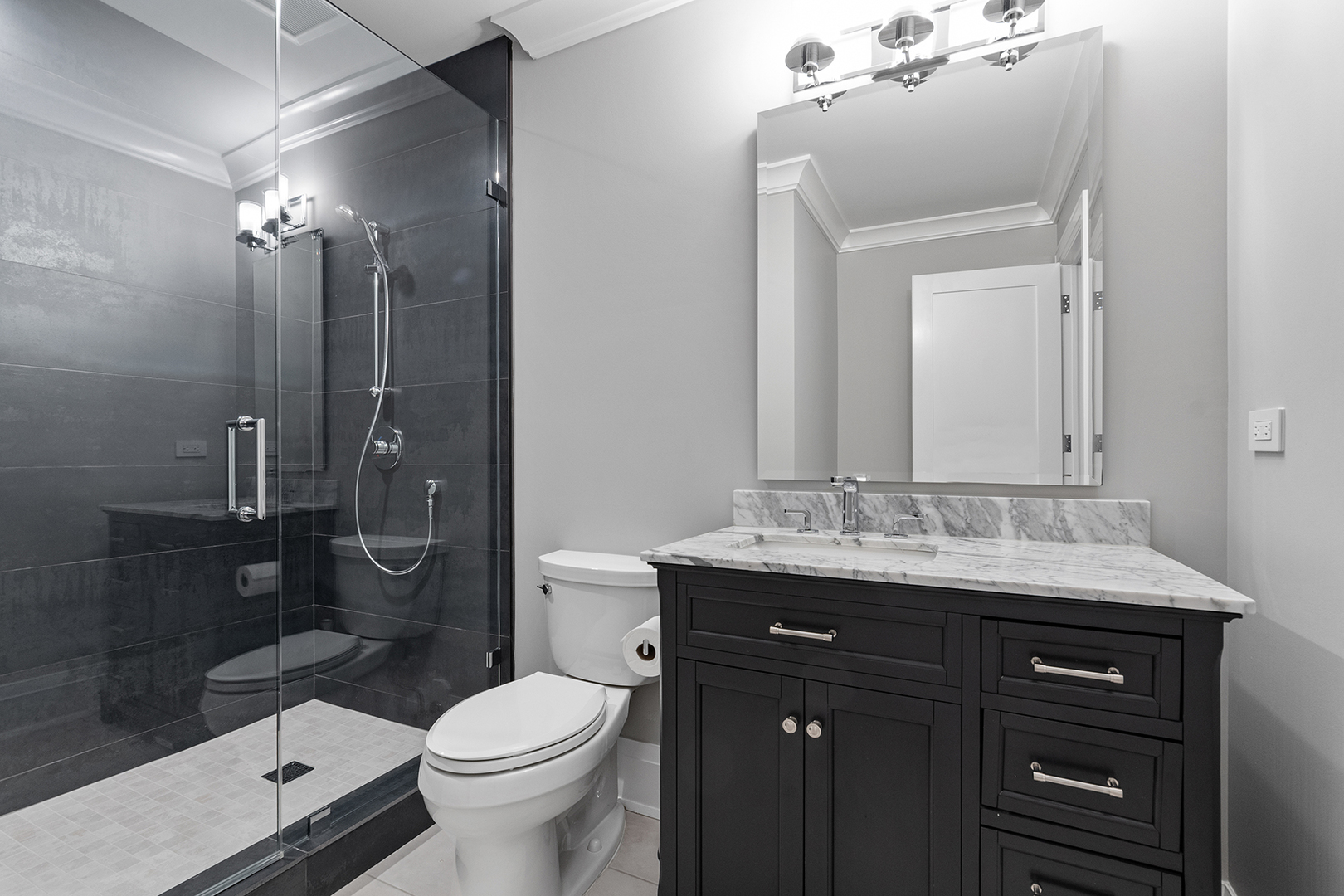 511 Lansdowne Lane Lake Bluff, IL 60044 - Photo 61 of 69 a bathroom with a granite countertop toilet sink shower and mirror